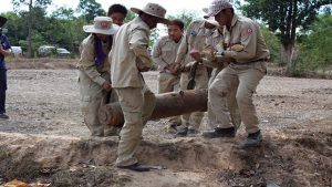 UXO operations team removing a large bomb